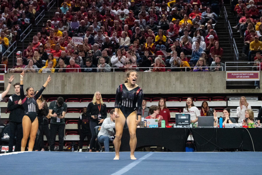 Maddie Diab celebrates after her floor routine during the match against Central Michigan in Hilton Coliseum on Feb. 12, 2023.