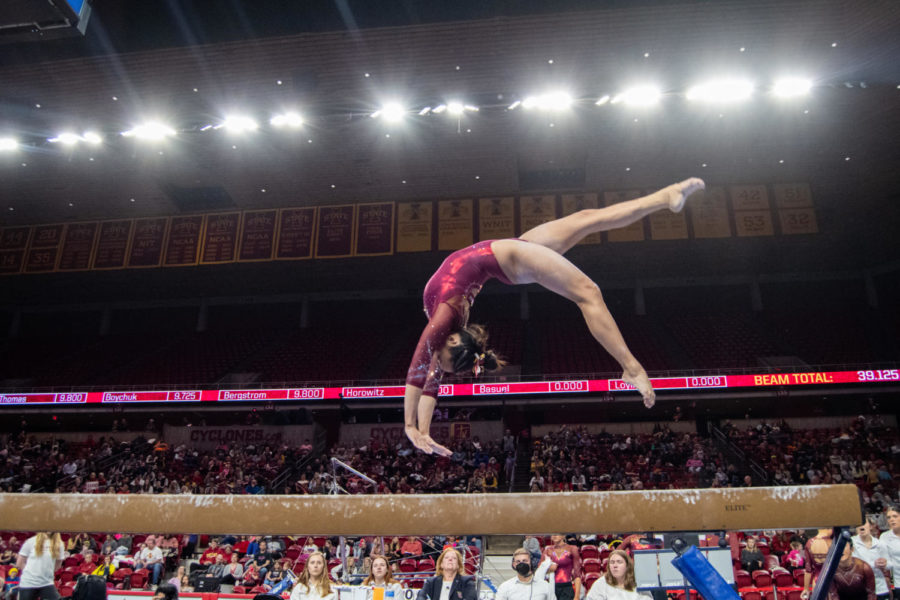 Loganne+Basuel+performs+a+backflip+in+her+beam+routine+during+the+meet+against+Denver+University+in+Hilton+Coliseum+on+Feb.+24%2C+2023.
