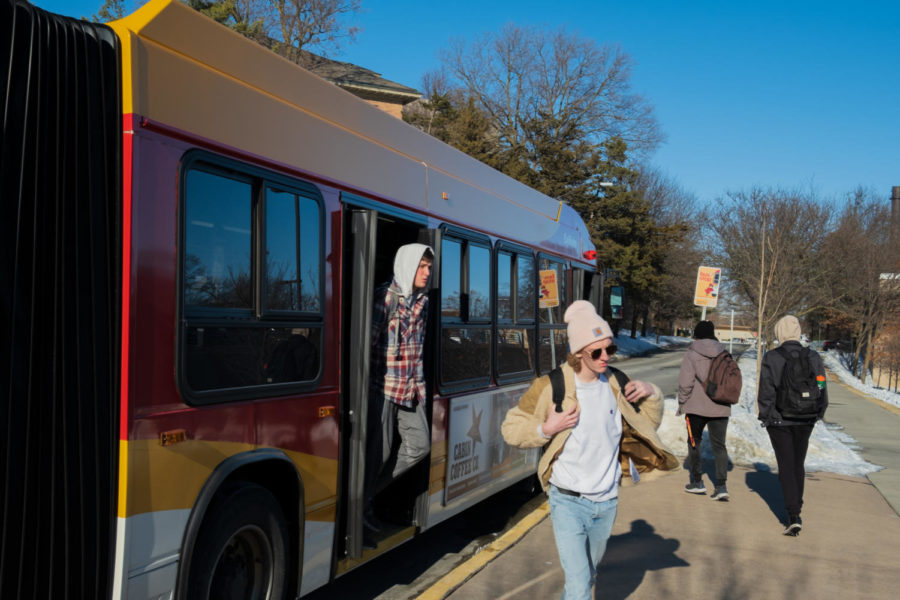 Students transfer on and off the Orange 23 bus on Wallace Road Feb. 1. 