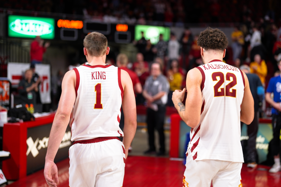 Eli King and Gabe Kalscheur walk off the floor after a 72-69 loss against West Virginia on Feb. 27, 2023.
