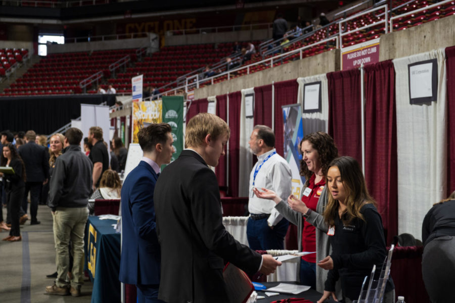 Iowa+State+students+speak+with+company+representatives+at+the+Iowa+State+Spring+Business+Career+Fair+at+Hilton+Coliseum%2C+Feb.+8.++