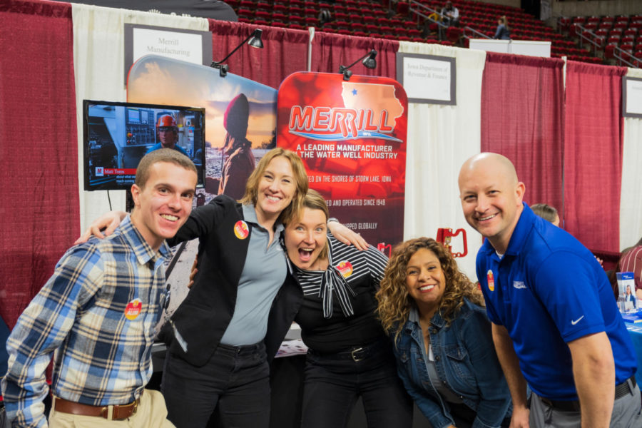 Merrill Manufacturing Company employees pose for a picture at the Business Career Fair at Hilton Coliseum on Feb. 8. 