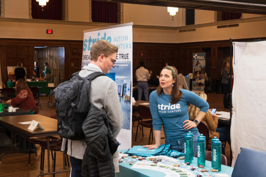 Stride Autism Centers talking with ISU student at people to people career fair