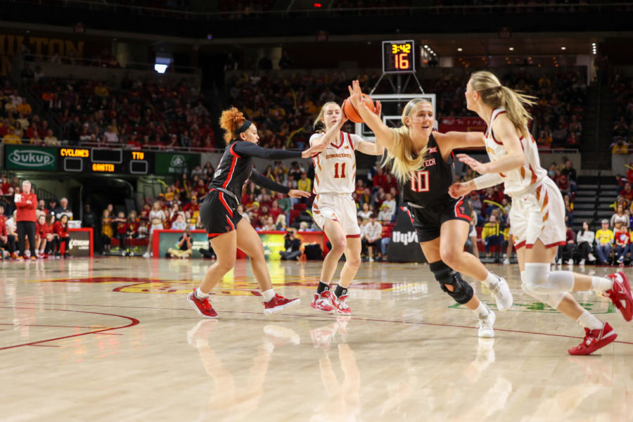 Emily Ryan attempts to pass the ball to Ashley Joenes against Texas Tech on March 4, 2023.