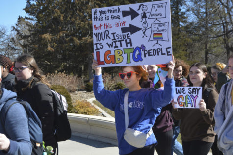Jackie Kluesner, an English education major, holds their sign in the LGBTQIA+ walkout on March 1, 2023.