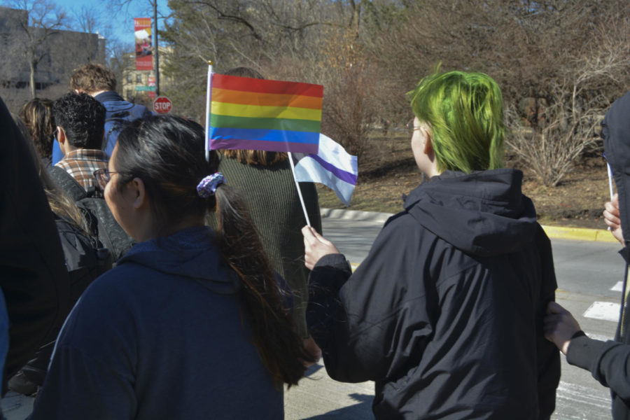 Rylee Foreman and Krystal Nguyen holding pride flags in the LGBTQIA+ walkout on March 1, 2023.