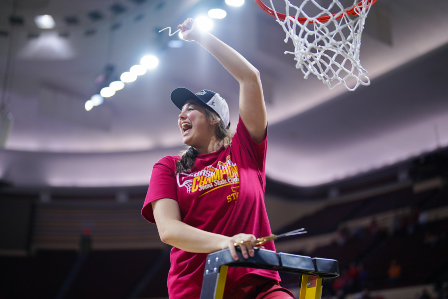 Izzi Zingaro cuts down the nets after Iowa State defeats Texas 61-51 in the Big 12 Championship on Mar. 12, 2023.