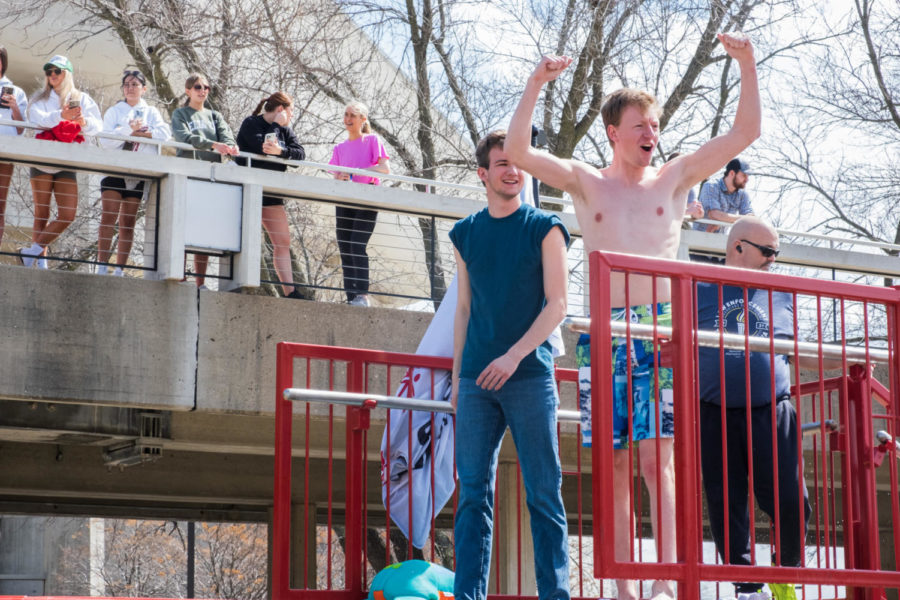 Jacob Fosse, a senior in mechanical engineering, and Gavin Petrak, a junior in computer engineering, hyping up the crowd before jumping into the water.