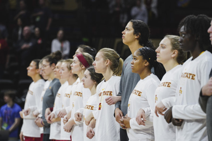 The ISU womens basketball team listens to the national anthem at the Big 12 womens basketball championship game, Municipal Auditorium in Kansas City, MO, Mar. 12, 2023.