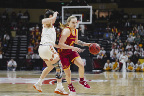 Denae Fritz drives the ball forward at the Big 12 womens basketball championship game, Municipal Auditorium in Kansas City, MO, Mar. 12, 2023.