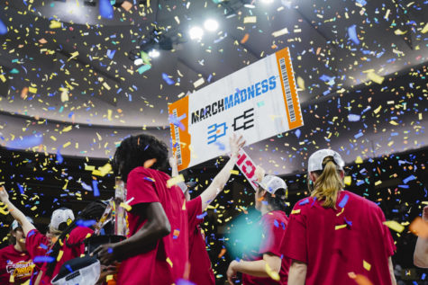 The Iowa State womens basketball team celebrates The Iowa State womens basketball team celebrates with their ticket punched March Madness sign on stage after ISUs Big 12 Championship win over Texas, 61-51. Municipal Auditorium in Kansas City, MO, Mar. 12, 2023.