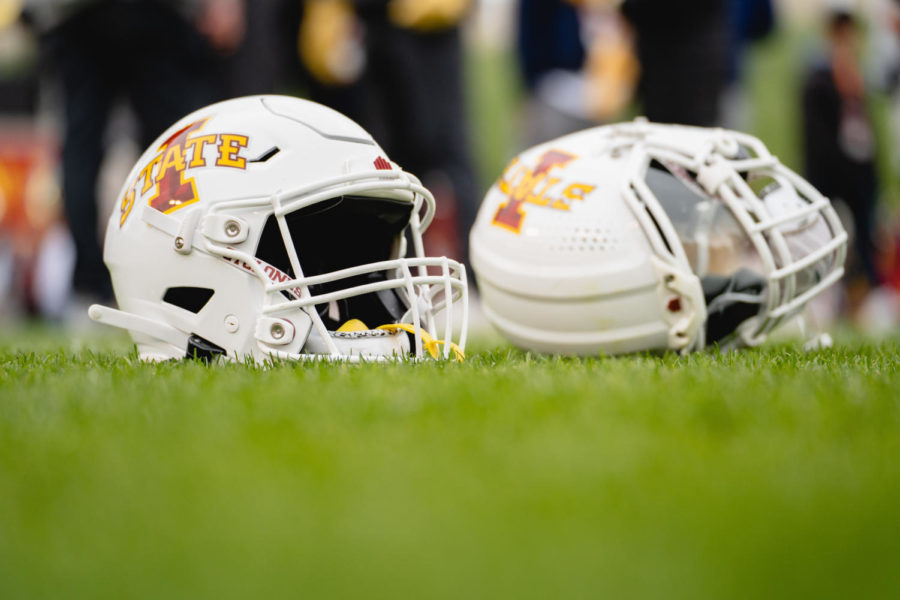Iowa State helmets lay on the field while players are interviewed after the Iowa State Spring football game, Jack Trice Stadium, April 22.