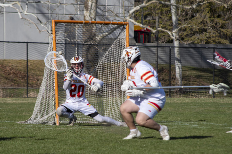 Tyler Evans blocks a shot during the game against Nebraska, eventually winning 24-2 at the Lied Recreation Center in Ames, Iowa on April 8, 2023.