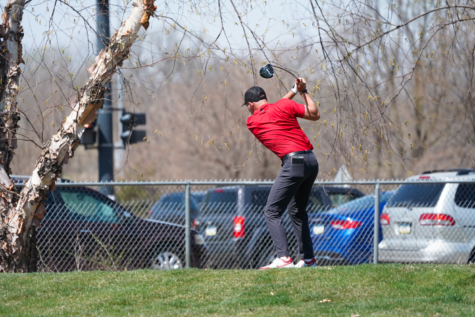 Paul Beauvy tees off at the Hawkeye Invitational on Apr. 14, 2023.