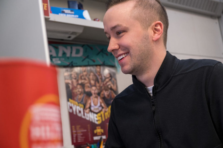Zach Gourley, the graphic design coordinator for Iowa State Athletics working on a new design in the Jacobson Building