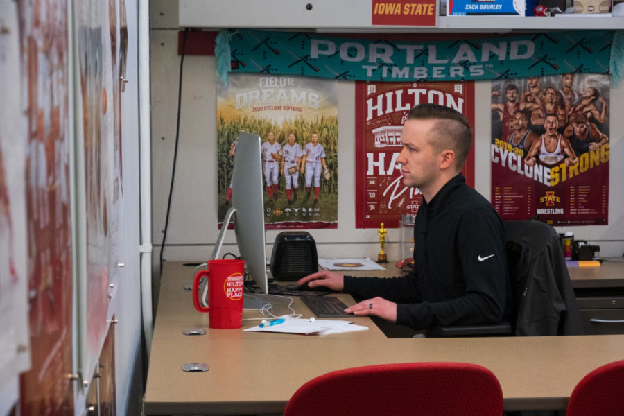 Zach Gourley, the graphic design coordinator for Iowa State Athletics working on a new design in the Jacobson Building