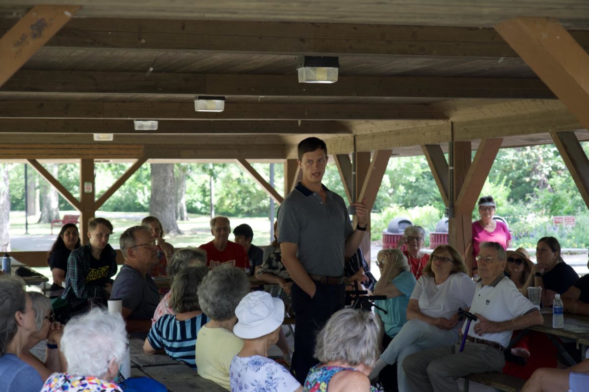 Rob Sand talks to constituents at Brookside Park in Ames as part of his 100 Town Halls Tour.