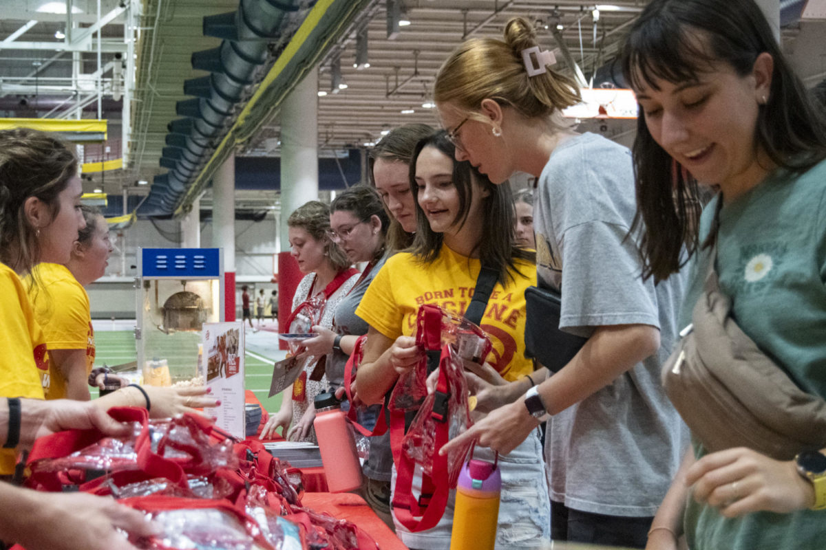 New Iowa State students receive merchandise at the Cyclone Welcome Weekend Cookout on Friday, Aug. 18, 2023, at the Lied Recreation Athletic Center in Ames.