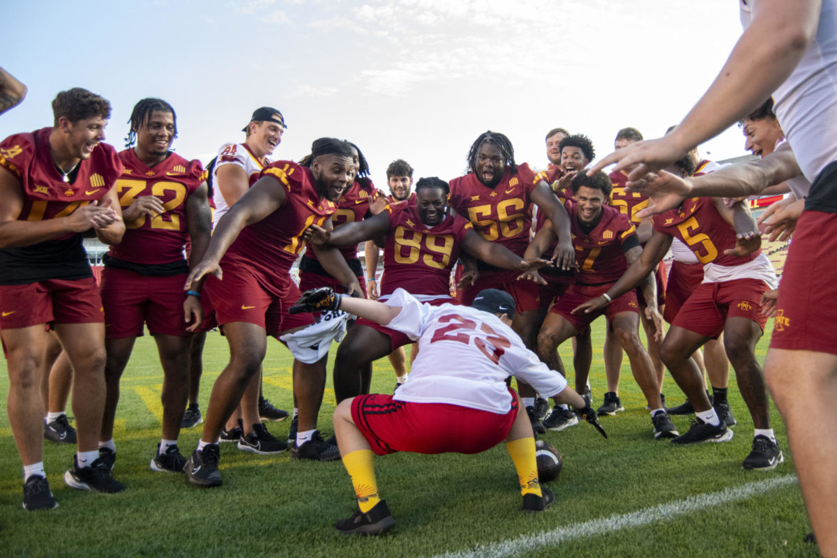 Tyler Osborn, 17, of Ames, celebrates with the team after scoring a touchdown during Iowa State’s Victory Day on Friday, Aug. 25, 2023, at Jack Trice Stadium in Ames.