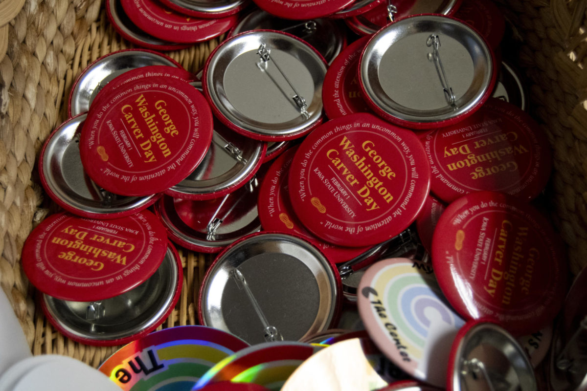 Buttons for George Washington Carver Day and other events sit in a basket at the Multicultural Student Affairs office on Tuesday, Aug. 29, 2023, in Iowa State’s Student Services Building in Ames.