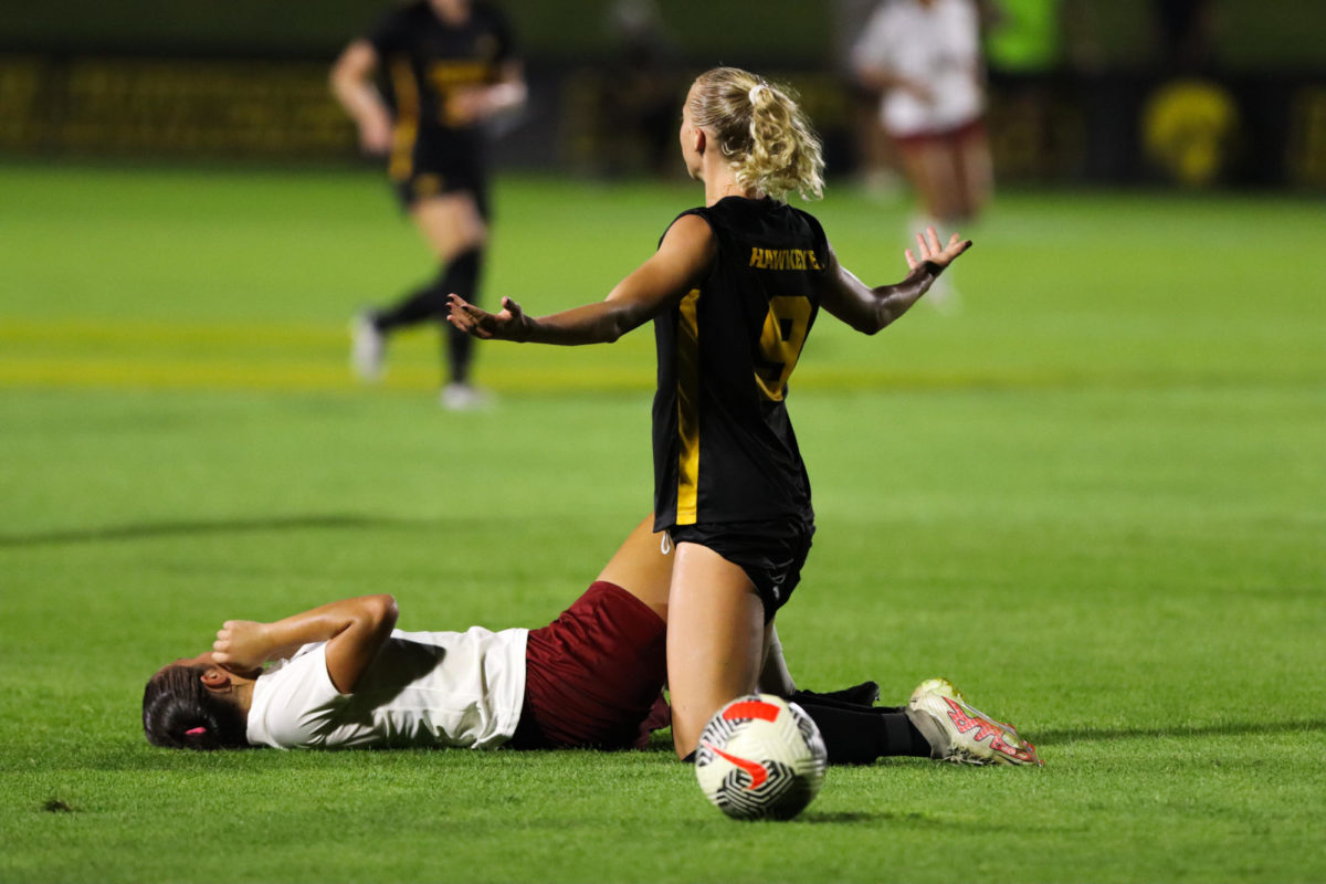 Iowas Samantha Cary raises their arms in confusion over a foul called during the Cy-Hawk soccer game, University of Iowa Soccer Complex, Aug. 24, 2023.