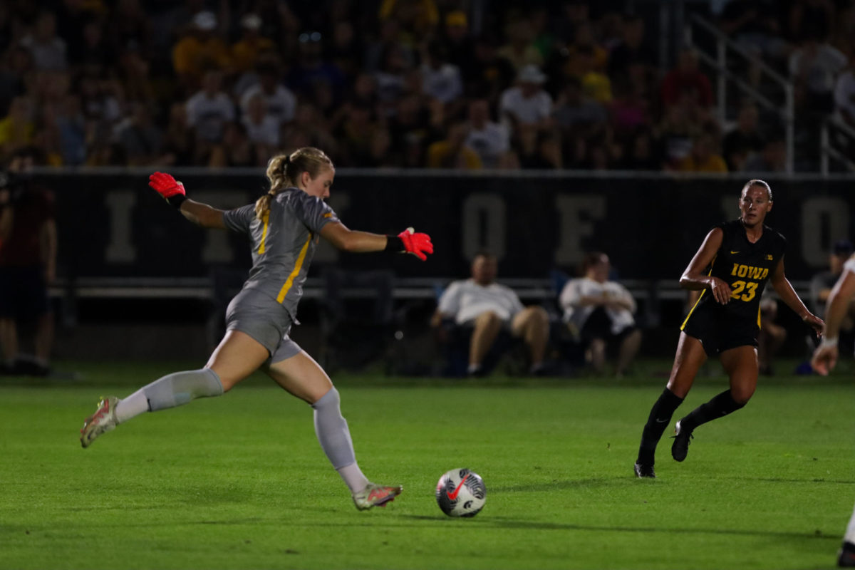 Avery Gillahan kicking the ball up the field during the CyHawk Soccer Game, University of Iowa Soccer Complex, Aug. 24, 2023.