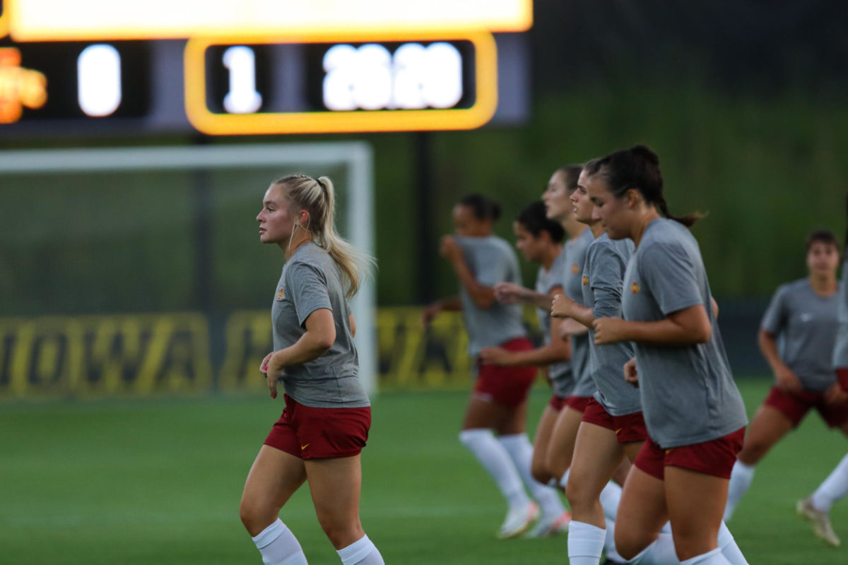 Hannah Shaw leading her team in warm ups before the CyHawk Soccer Game, University of Iowa Soccer Complex, Aug. 24, 2023.