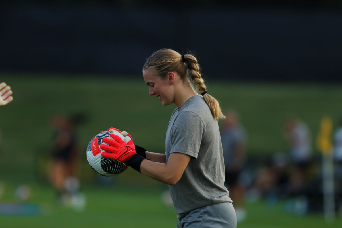 Avery Gillahan warming up for the CyHawk Soccer Game, University of Iowa Soccer Complex, Aug. 24, 2023.