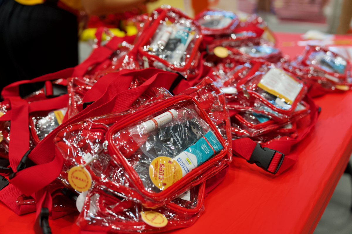 Free goodie bags consisting of a bottle opener, stickers, Liquid I.V. and more were provided to students during the Iowa State Welcome Cookout in Lied Rec Center on Aug. 18, 2023.