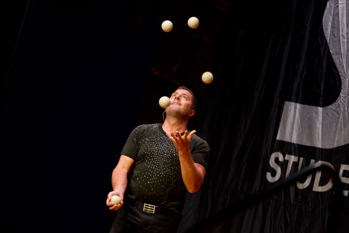 The Great Dubois front man Michael DuBois completing a juggling act for the Great Halls audience located in the Memorial Union on Aug. 18, 2023.