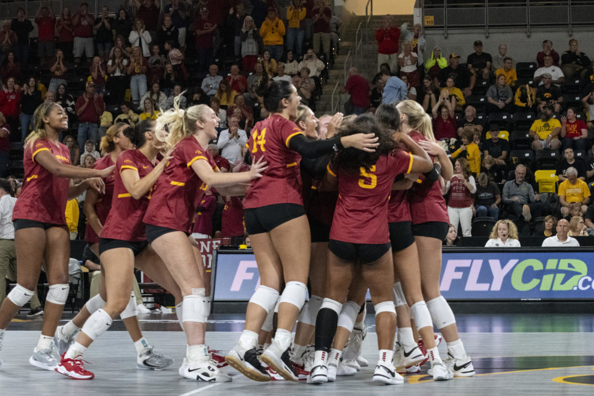 The Iowa State volleyball team rushes the court after defeating Iowa 3-2 in a comeback win during the Iowa Corn Cy-Hawk Series on Wednesday, Sept. 6, 2023, at the Xtreme Arena in Coralville, Iowa. The Cyclones went into the third set down 2-0, but came back and won the next three sets, winning 3-2.