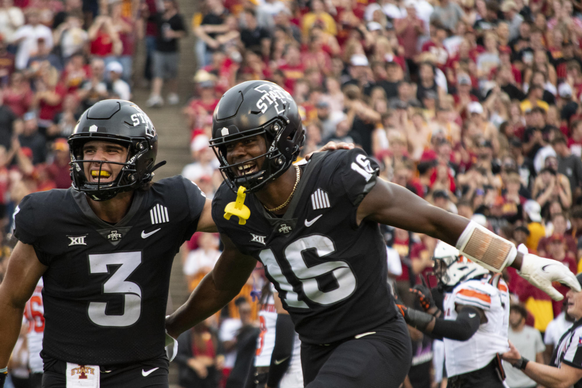 Iowa State’s Daniel Jackson (16) celebrates with Rocco Becht (3) after scoring a touchdown during the first half of the football game against Oklahoma State on Saturday, Sept. 23, 2023, at Jack Trice Stadium in Ames, Iowa.