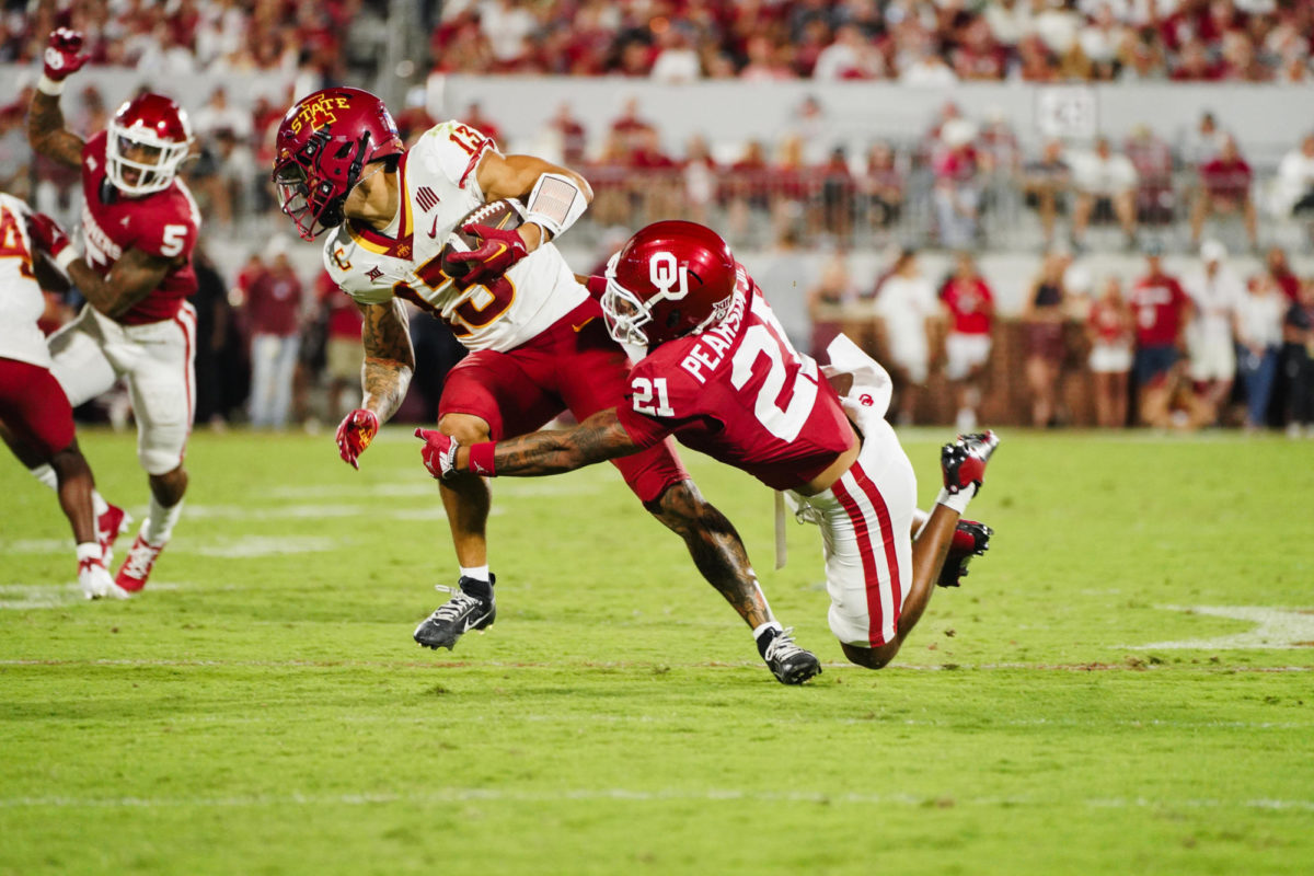 Jaylin Noel is taken down by OU defender Reggie Pearson during the ISU vs. OU football game at Gaylord Memorial Stadium in Norman, OK on Sept. 30, 2023.
