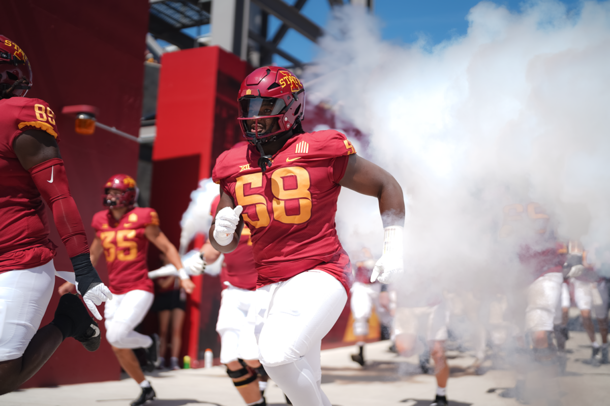 J.R. Singleton runs onto the field moments before kickoff against UNI at Jack Trice Stadium on Sept. 2, 2023.