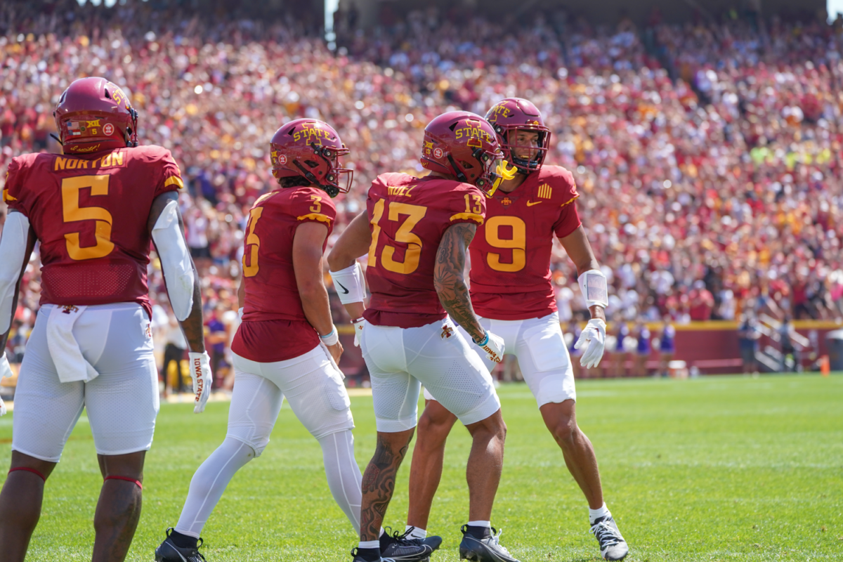 Rocco Becht, Jaylin Noel, and Jayden Higgens celebrate a QB sneak touchdown by Becht against UNI at Jack Trice Stadium on Sep. 2, 2023.