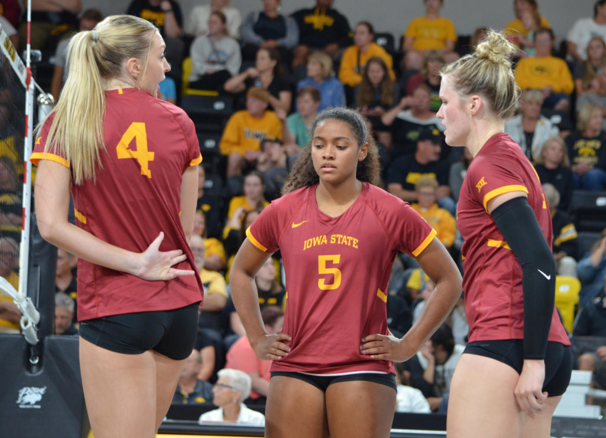 Iowa States Jordan Hopp, left, shows Maya Duckworth, center, and Morgan Brandt, right, the play during the game against the University of Iowa on Wednesday, Sept. 6, 2023.