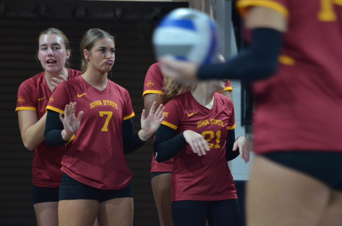 Iowa State University volleyball player, Addi Heidemann, roots for her teammates after a point scored against the University of Iowa during the game on Wednesday, Sept. 6, 2023.