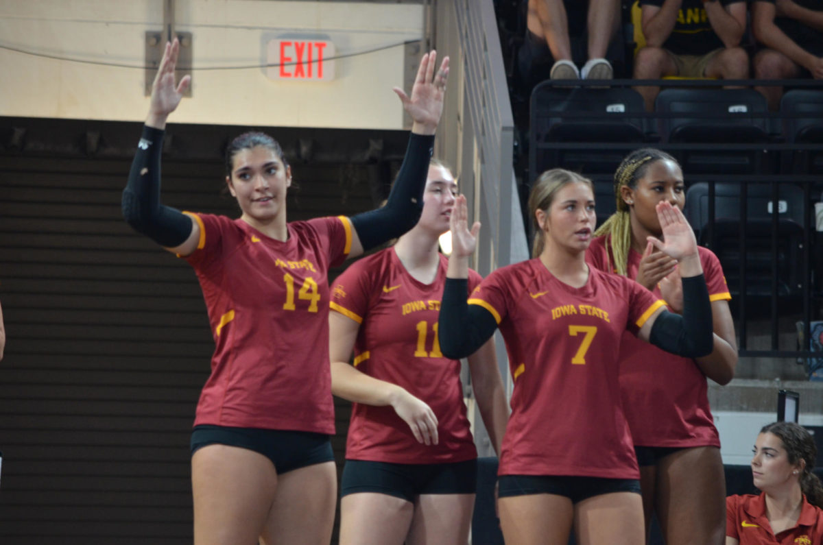 Iowa State University volleyball players, Nayeli Gonzalez, left, and Addi Heidemann, right, on the sidelines during the game against the University of Iowa on Wednesday, Sept. 6, 2023.