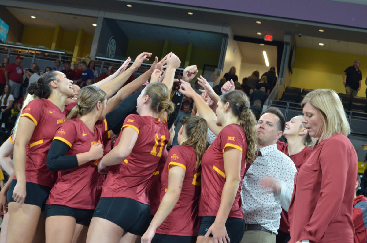 The Iowa State volleyball team huddles up after their win against the University of Iowa at Xtream Arena on Wednesday, Sept. 6, 2023. After being down in the first two sets, they came back to win the final three.