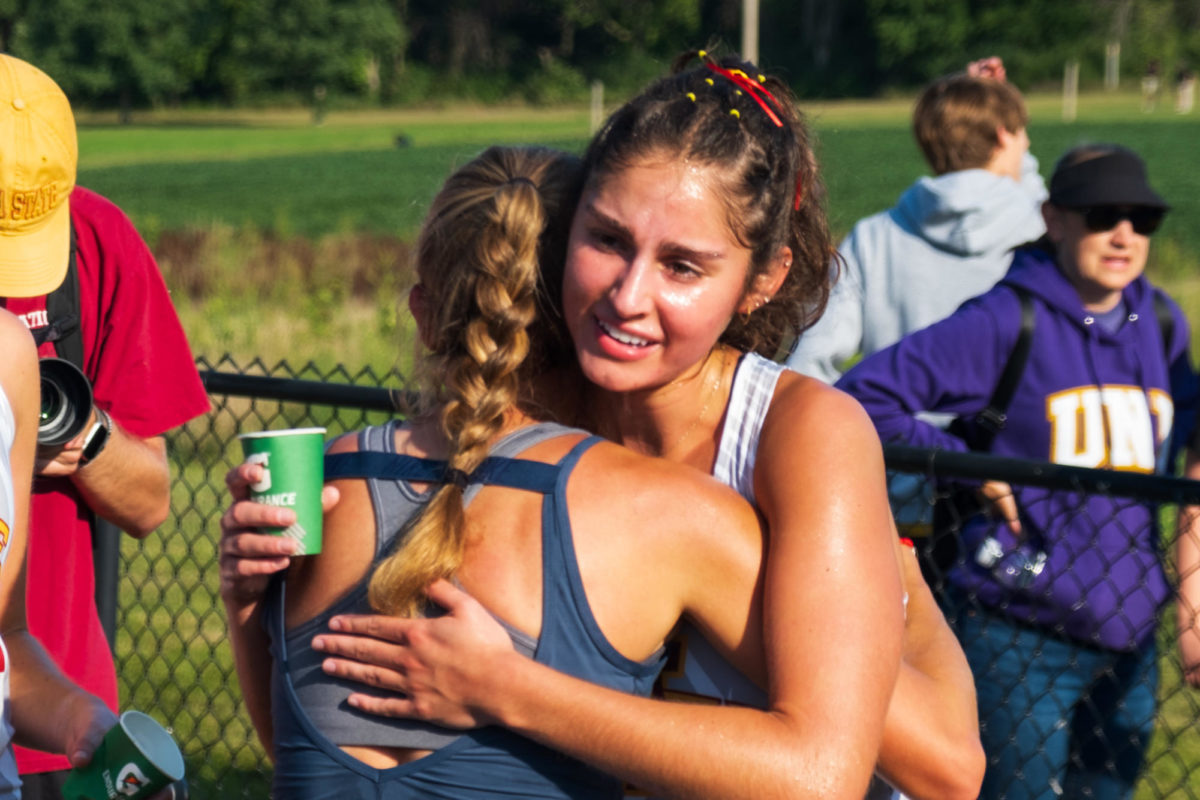 Mya Trober (right) hugging teammate after Cyclone Preview on Sept. 1, 2023.