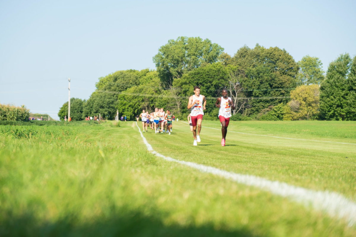 Silas Winders (left) and Kelvin Bungei (right) run the first stretch of the Cyclone Preview at the Iowa State University Cross Country Course in Ames, Iowa, Sept. 1, 2023.
