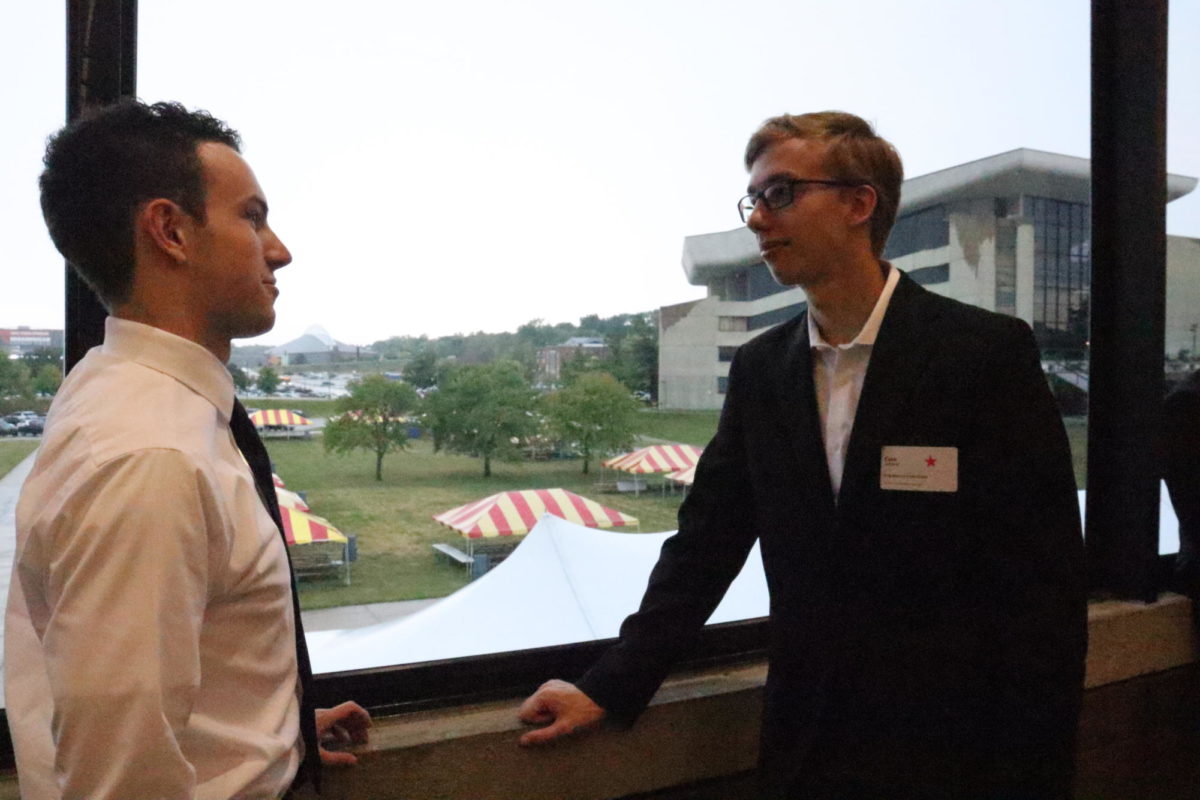 Evan Johnson (right) a freshman in engineering discusses career fair with friend Ben (left)