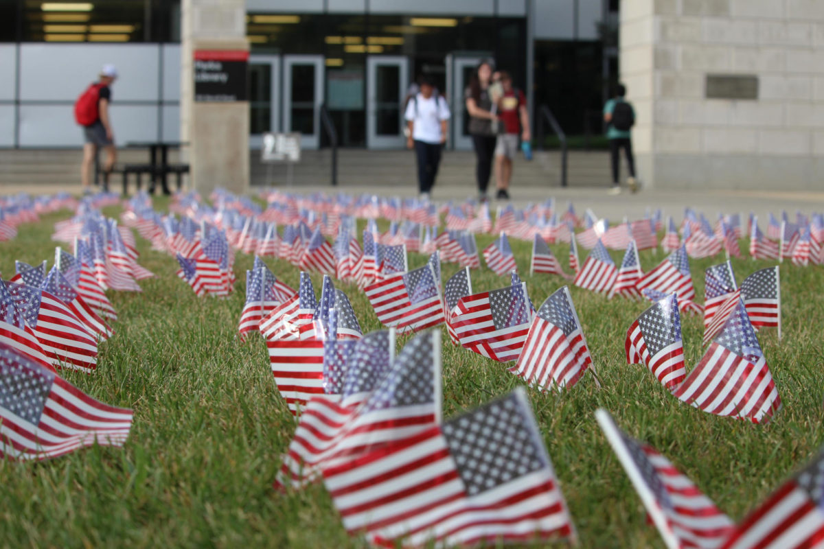 Students walk past the 9/11 memorial outside of Parks Library on Sept. 11, 2023 as a reminder of those who died.  