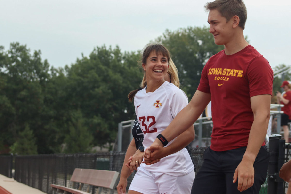 Mira Emma holding hands with her family for her senior recognition at the Iowa State vs. Kentucky Womens Soccer match at the Cyclone Sports Complex on Sept. 10, 2023. 