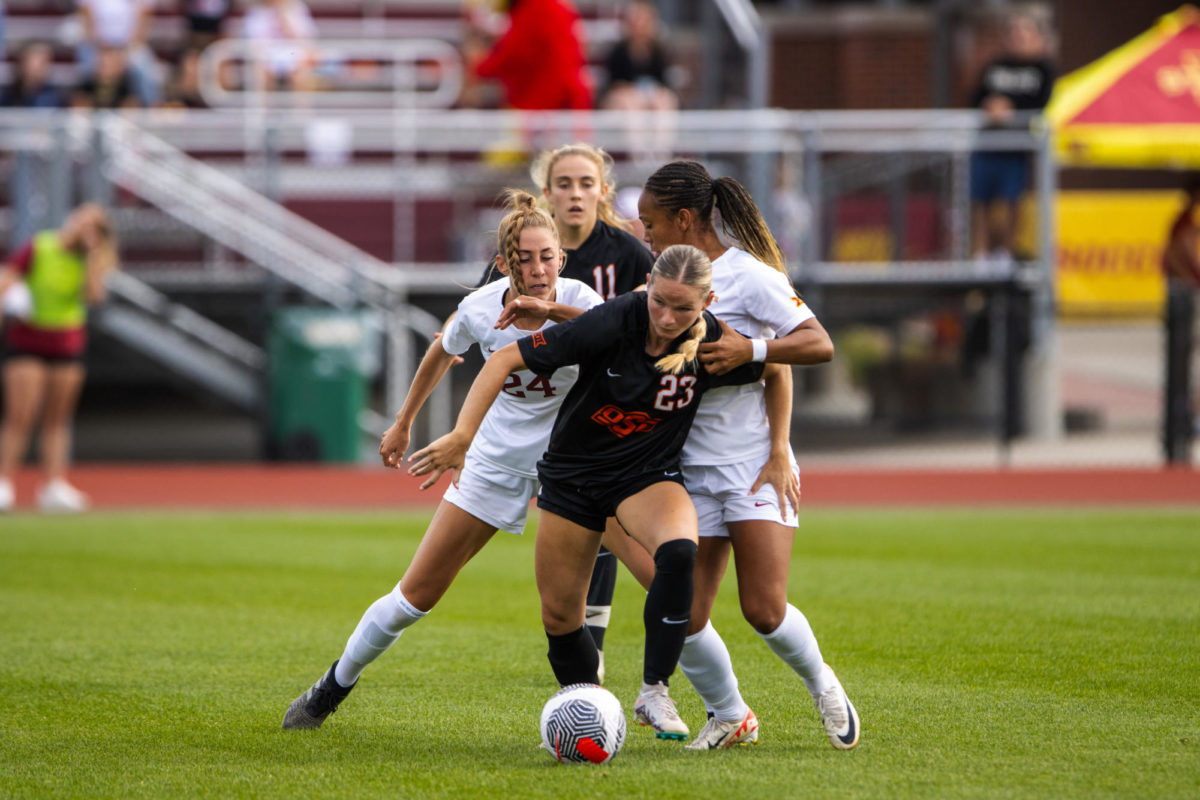 Abigail Miller and Salomé Prat playing physical against Oklahoma States Megan Haines during the Iowa State vs. Oklahoma State match, Cyclone Sports Complex, Sept. 14, 2023.