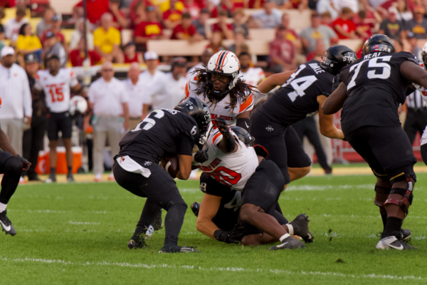 Eli Sanders running the ball for a gain of 2 at the Iowa State vs. Oklahoma State football game on Sept. 23, 2023.