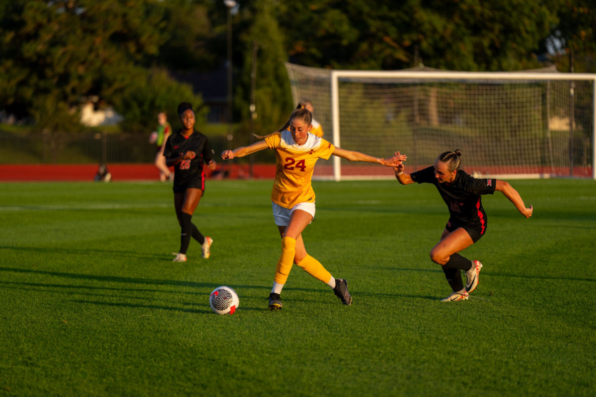 Abigail Miller getting through a defender during the Iowa State vs. Houston match, Cyclone Sports Complex, Sept. 28, 2023.