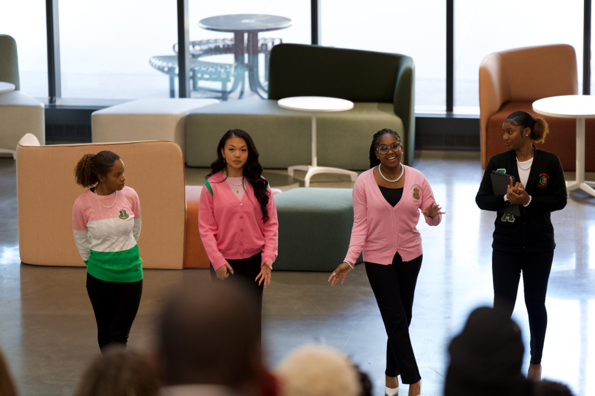 AKA members Olivia Plant, Kyra Lucas, Joann Nguyen and Jasmine Williams presenting at the Nation Pan-Hellenic Council Meet the Greeks event in the Student Innovation Center on Sept. 14, 2023.