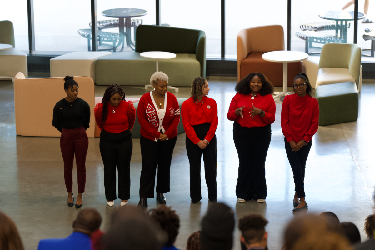 Delta Sigma Theta members (List here) presenting to a packed crowd at the Nation Pan-Hellenic Council Meet the Greeks event in the Student Innovation Center on Sept. 14, 2023.