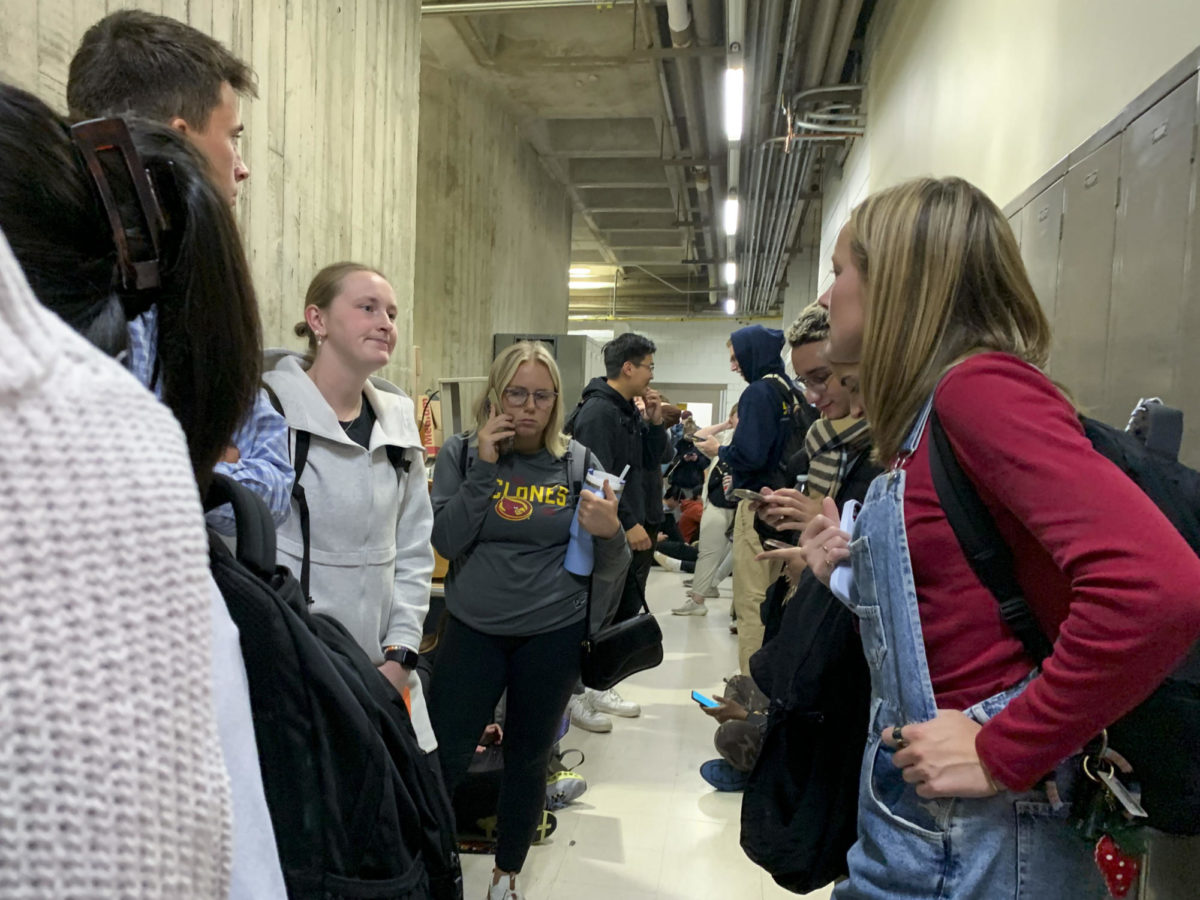 Iowa State students and faculty take cover as a portion of central Iowa receives a tornado warning on Friday, Oct. 13, 2023, at the lower levels of the Iowa State University College of Design in Ames, Iowa.